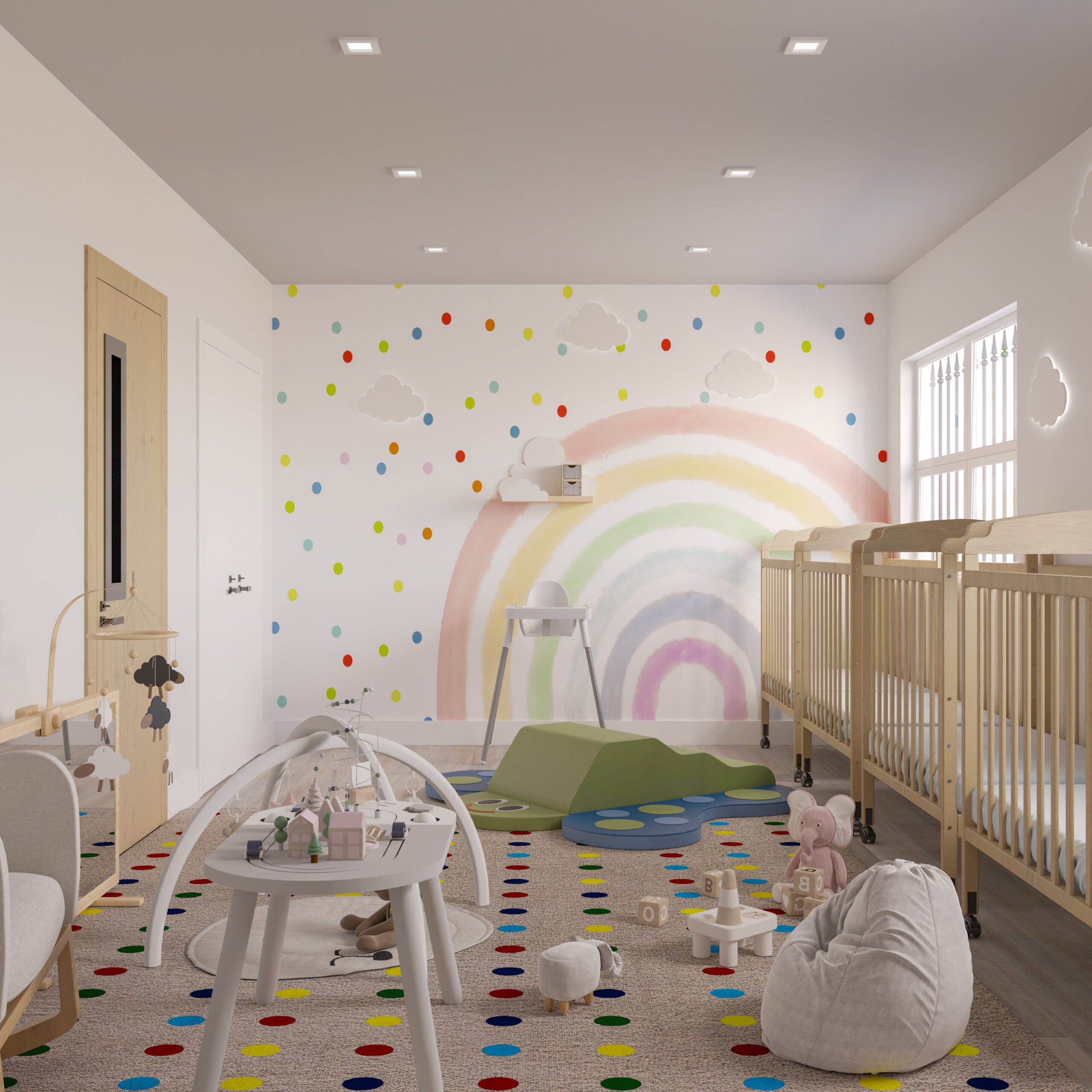 childcare interior design with infant room, cribs, rainbow mural, and soft play area