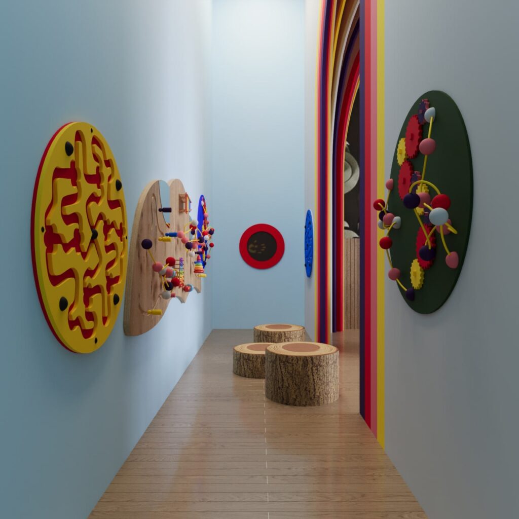 pediatric dental play area with rainbow arch, child table, and soft seating