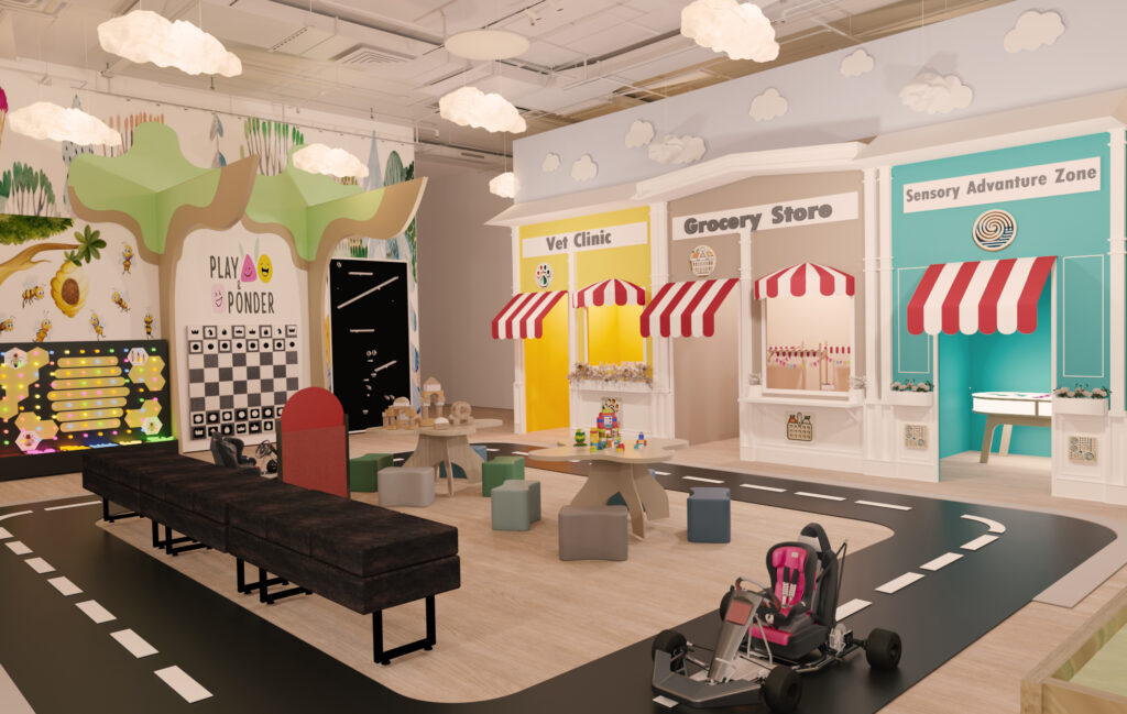 indoor playground sensory play area with activity tables and pretend play zones