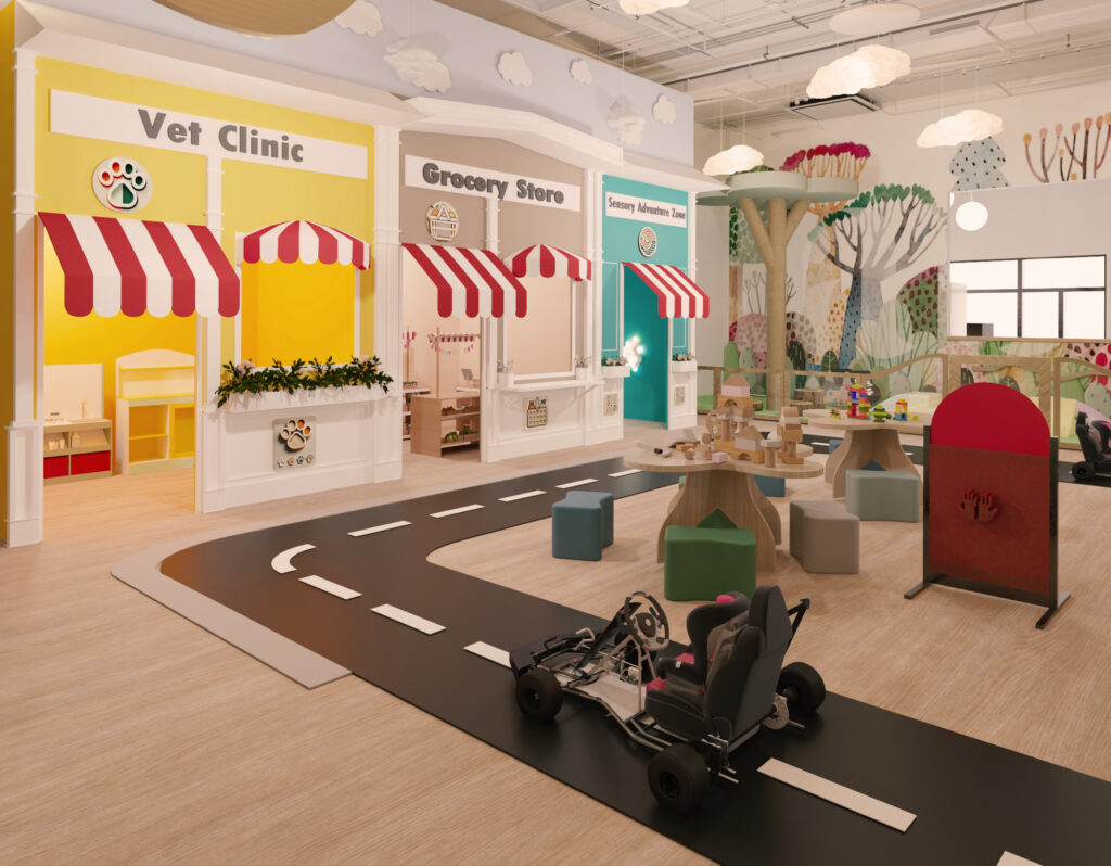 indoor playground with go kart track, soft play area, and nature mural