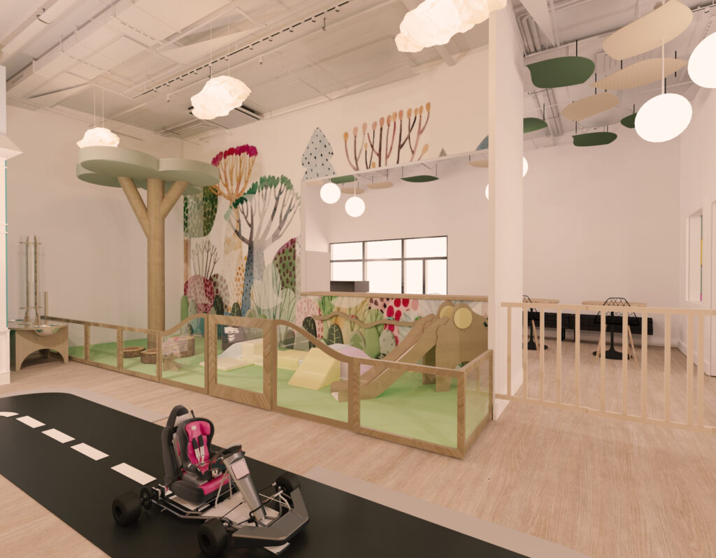 indoor playground with toddler soft climber, tree feature, and nature wall mural
