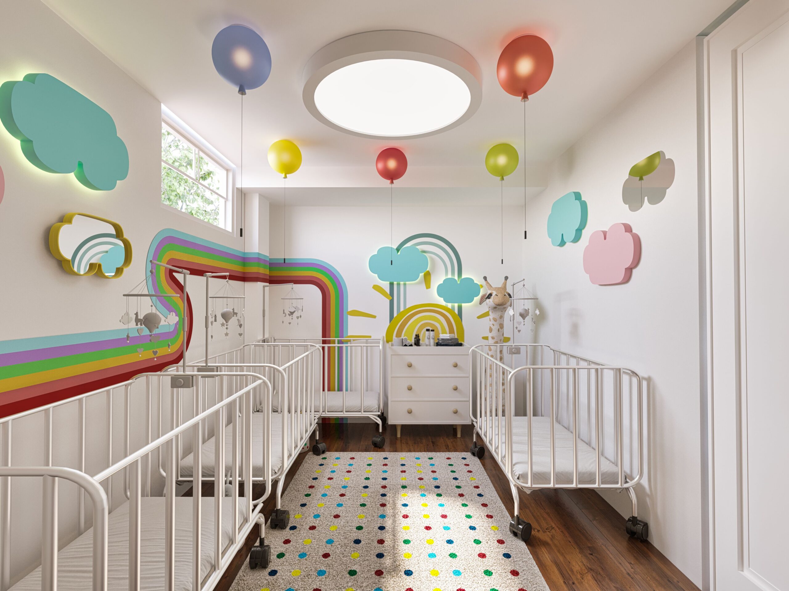 home daycare infant room with white cribs, balloon ceiling lights, rainbow mural, and cloud wall decor