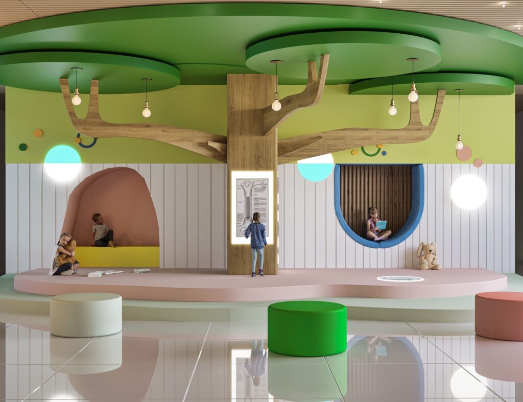 nature inspired indoor play lobby with tree feature and children reading nooks